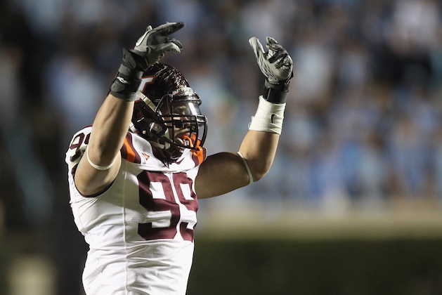 CHAPEL HILL, NC - NOVEMBER 13:  James Gayle #99 of the Virginia Tech Hokies celebrates after a sack against the North Carolina Tar Heels during their game at Kenan Stadium on November 13, 2010 in Chapel Hill, North Carolina.  (Photo by Streeter Lecka/Getty Images)