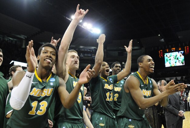 Mar 20, 2014; Spokane, WA, USA; North Dakota State Bison guard Carlin Dupree (13), guard Mike Felt (3), guard Lawrence Alexander (12), and guard Kory Brown (22) celebrate after overtime a men's college basketball game during the second round of the 2014 NCAA Tournament against the Oklahoma Sooners at Veterans Memorial Arena. The Bison defeated the Sooners 80-75. Mandatory Credit: James Snook-USA TODAY Sports