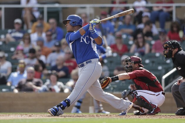 Kansas City Royals' Salvador Perez singles while batting against the Arizona Diamondbacks during the first inning of an exhibition spring training baseball game Wednesday, March 5, 2014, in Scottsdale, Ariz. (AP Photo/Gregory Bull)
