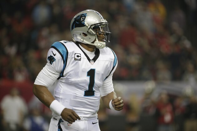 Carolina Panthers quarterback Cam Newton (1) works against the Atlanta Falcons during the first half of an NFL football game, Sunday, Dec. 29, 2013, in Atlanta. (AP Photo/Dave Martin)