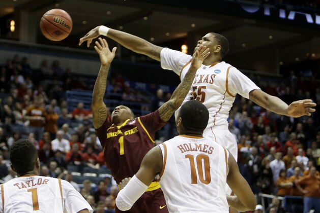 MILWAUKEE, WI - MARCH 20:  Cameron Ridley #55 of the Texas Longhorns blokcs a shot by Jahii Carson #1 of the Arizona State Sun Devils in the second half during the second round of the 2014 NCAA Men's Basketball Tournament at BMO Harris Bradley Center on March 20, 2014 in Milwaukee, Wisconsin.  (Photo by Mike McGinnis/Getty Images)