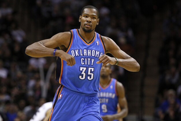Jan 22, 2014; San Antonio, TX, USA; Oklahoma City Thunder forward Kevin Durant (35) reacts after a shot during the second half against the San Antonio Spurs at AT&T Center. The Thunder won 111-105. Mandatory Credit: Soobum Im-USA TODAY Sports