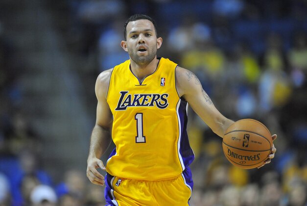 October 5, 2013; Ontario, CA, USA; Los Angeles Lakers point guard Jordan Farmar (1) moves the ball up court against the Golden State Warriors during the second half at Citizens Business Bank Arena. Mandatory Credit: Gary A. Vasquez-USA TODAY Sports