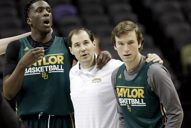 Baylor's Taurean Prince, left, coach Scott Drew, center, and Brady Heslip wait for the rest of the team to join them at center court during practice for the NCAA college basketball tournament in San Antonio, Thursday, March 20, 2014. Baylor plays against Nebraska in a second-round game on Friday. (AP Photo/David J. Phillip) Baylor's Taurean Prince, left, coach Scott Drew, center, and Brady Heslip wait for the rest of the team to join them at center court during practice for the NCAA college basketball tournament in San Antonio, Thursday, March 20, 2014. Baylor plays against Nebraska in a second-round game on Friday. (AP Photo/David J. Phillip)