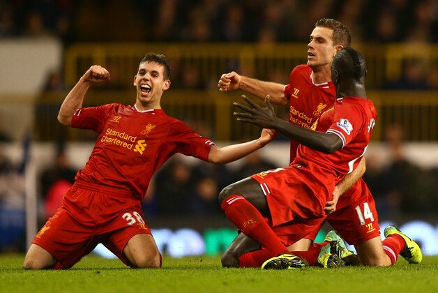 LONDON, ENGLAND - DECEMBER 15:  Jordan Henderson of Liverpool celebrates scoring their second goal with Jon Flanagan (L) and Mamadou Sakho of Liverpool (R) during the Barclays Premier League match between Tottenham Hotspur and Liverpool at White Hart Lane on December 15, 2013 in London, England.  (Photo by Paul Gilham/Getty Images)