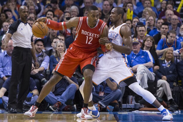 OKLAHOMA CITY, OK - MARCH 11, 2014:  Dwight Howard #12 of the Houston Rockets handles the ball against Serge Ibaka #9 of the Oklahoma City Thunder at the Chesapeake Arena on March 11, 2014 in Oklahoma City, Oklahoma. NOTE TO USER:  User expressly acknowledges and agrees that, by downloading and/or using this photograph, user is consenting to the terms and conditions of the Getty Images License Agreement. Mandatory Copyright Notice:  Copyright 2014 NBAE (Photo by Richard Rowe/NBAE via Getty Images)