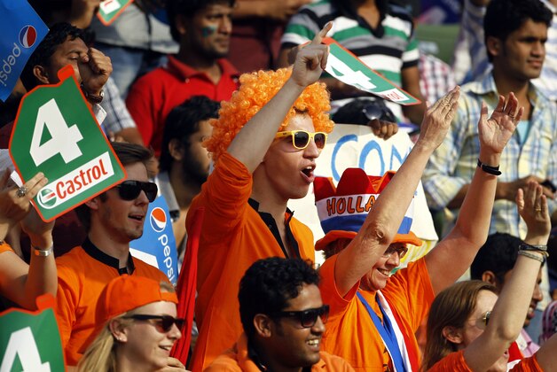 Supporters of Netherlands cricket team watch the ICC Twenty20 Cricket World Cup match between Netherlands and Ireland in Sylhet, Bangladesh, Friday, March 21, 2014. (AP Photo/A.M. Ahad)