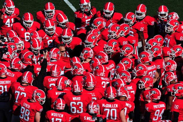 ATHENS, GA - NOVEMBER 17: Head Coach Mark Richt of the Georgia Bulldogs huddles with his team before the game against the Georgia Southern Eagles at Sanford Stadium on November 17, 2012 in Athens, Georgia. (Photo by Scott Cunningham/Getty Images)