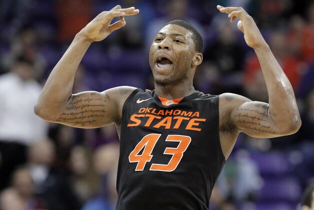 Oklahoma State Marcus Smart celebrates scoring a three pointer against TCU in the second half of an NCAA college basketball game, Monday, Feb. 24, 2014, in Fort Worth, Texas. Oklahoma State won 76-54. (AP Photo/Brandon Wade)