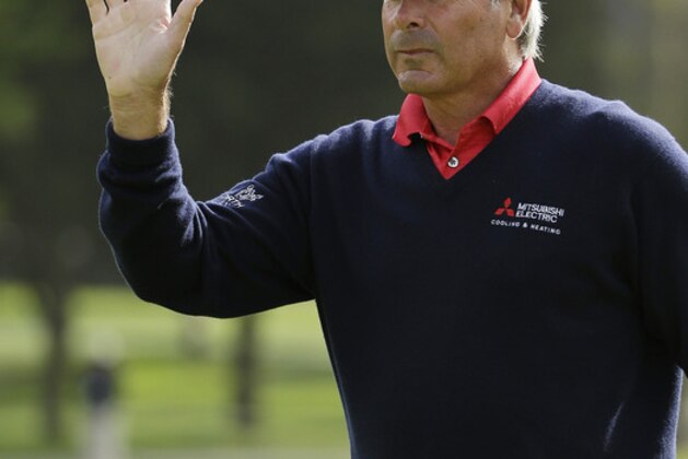 Fred Couples waves after making a birdie on the fifth green of TPC Harding Park during the final round of the Charles Schwab Cup Championship Champions Tour golf tournament Sunday, Nov. 3, 2013, in San Francisco. (AP Photo/Eric Risberg)