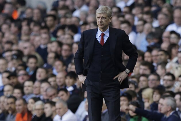 Arsenal's manager Arsene Wenger watches his team play from the technical area during the English Premier League soccer match between Tottenham Hotspur and Arsenal at White Hart Lane stadium in London, Sunday, March 16, 2014. (AP Photo/Matt Dunham)