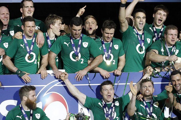 Ireland's rugby team players celebrate after defeating France and winning the Six Nations Rugby Union tournament at the stade de France stadium, in Saint Denis, outside Paris, Saturday, March 15, 2014. (AP Photo/Christophe Ena)