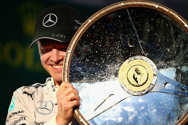 MELBOURNE, AUSTRALIA - MARCH 16:  Nico Rosberg of Germany and Mercedes GP celebrates on the podium after winning the Australian Formula One Grand Prix at Albert Park on March 16, 2014 in Melbourne, Australia.  (Photo by Clive Mason/Getty Images)