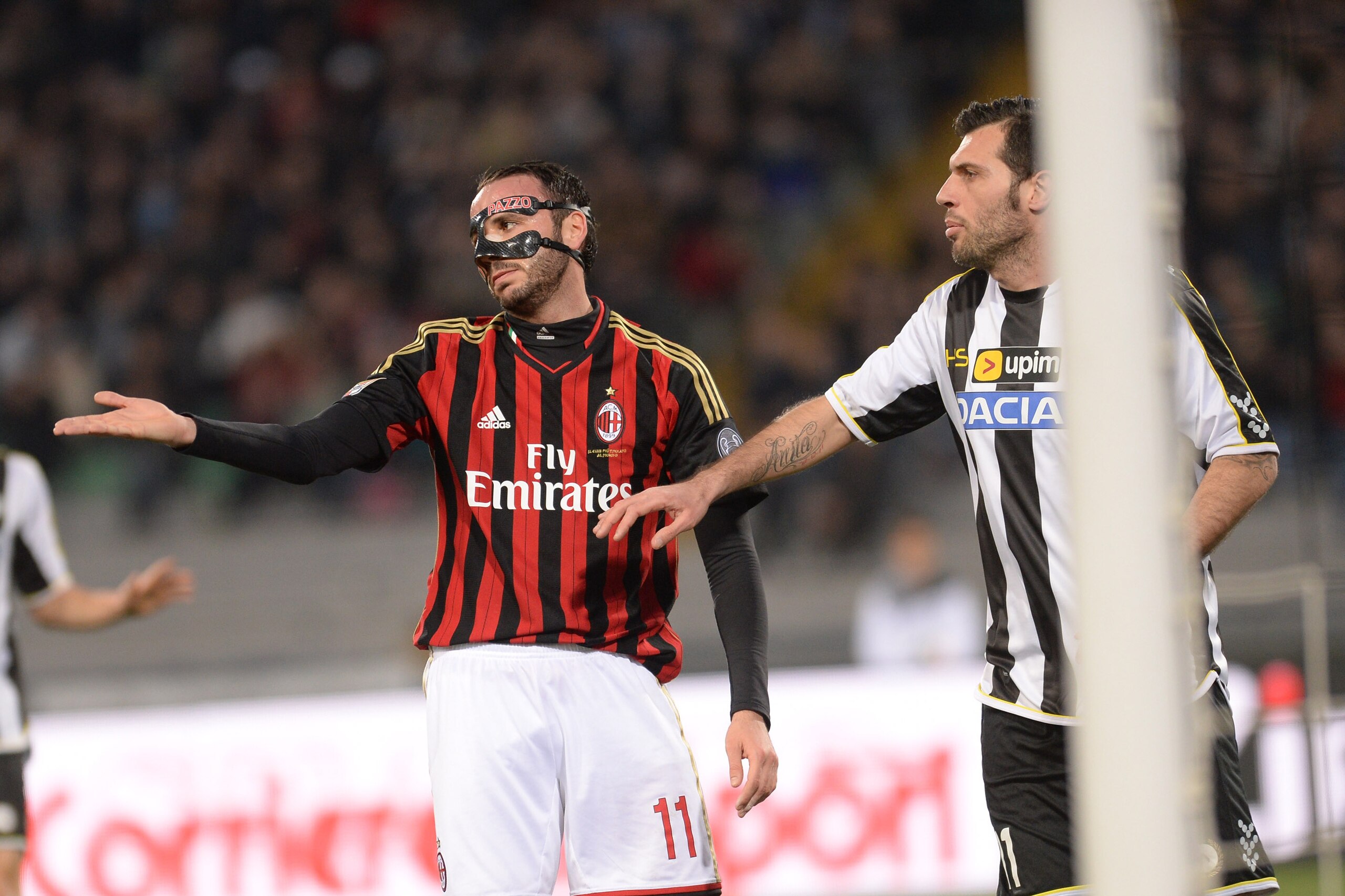 UDINE, ITALY - MARCH 08: Maurizio Domizzi (R) of Udinese Calcio and  Giampaolo Pazzini  of AC Milan react during the Serie A match between Udinese Calcio and AC Milan at Stadio Friuli on March 8, 2014 in Udine, Italy.  (Photo by Dino Panato/Getty Images)
