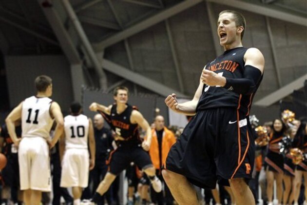Princeton's Ian Hummer, right, and T.J. Bray, rear, celebrate at the end of the second half of an NCAA college basketball game against Harvard in Princeton, N.J., Saturday, Feb. 11, 2012. Princeton won 70-62. (AP Photo/Mel Evans)
