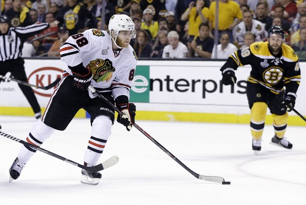 Chicago Blackhawks right wing Patrick Kane  carries the puck against Boston Bruins center Rich Peverley, right, during the third period in Game 6 of the NHL hockey Stanley Cup Finals Monday, June 24, 2013, in Boston. Kane was presented the Conn Smythe Trophy, awarded to the team's most valuable player, and the Blackhawks beat the Bruins 3-2, to win the Stanley Cup.   (AP Photo/Elise Amendola)
