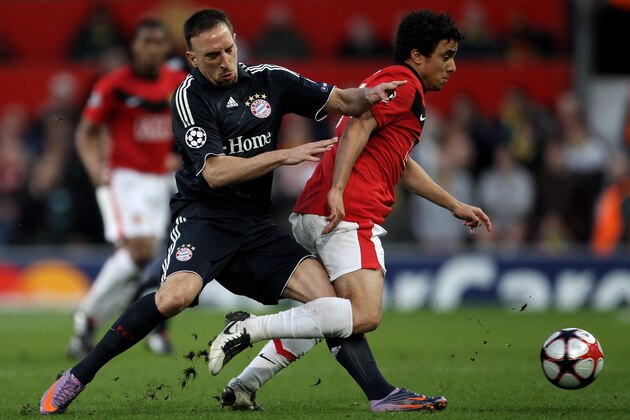 MANCHESTER, ENGLAND - APRIL 07:   Franck Ribery of Bayern Muenchen battles for the ball with Rafael of Manchester United during the UEFA Champions League Quarter Final second leg match between Manchester United and Bayern Muenchen at Old Trafford on April 7, 2010 in Manchester, England.  (Photo by Alex Livesey/Getty Images)