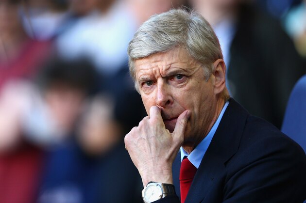 LONDON, ENGLAND - MARCH 16:  Arsene Wenger manager of Arsenal looks on during the Barclays Premier League match between Tottenham Hotspur and Arsenal at White Hart Lane on March 16, 2014 in London, England.  (Photo by Paul Gilham/Getty Images)