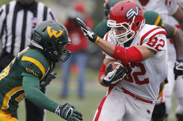 Saginaw Valley wide receiver Jeff Janis (82) is pursued by Wayne State safety David Churchwell during the fourth quarter of their Division II NCAA football game Saturday, Oct. 19, 2013, in Detroit. Janis scored two touchdowns in Saginaw Valley's 14-10 win over Wayne State. (AP Photo/Duane Burleson)