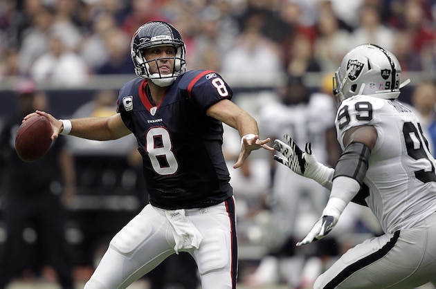 HOUSTON - OCTOBER 09: Quarterback Matt Schaub #8 of the Houston Texans throws under pressure from Lamarr Houston #99 of the Oakland Raiders at Reliant Stadium on October 9, 2011 in Houston, Texas. (Photo by Bob Levey/Getty Images)