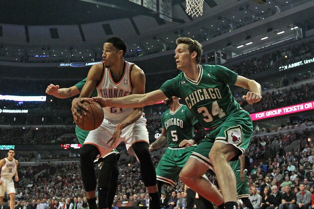 CHICAGO, IL - MARCH 17: Mike Dunleavy #34 of the Chicago Bulls tries to knock the ball away from Andre Roberson #21 of the Oklahoma City Thunder at the United Center on March 17, 2014 in Chicago, Illinois. NOTE TO USER: User expressly acknowledges and agrees that, by downloading and or using this photograph, User is consenting to the terms and conditions of the Getty Images License Agreement. (Photo by Jonathan Daniel/Getty Images)