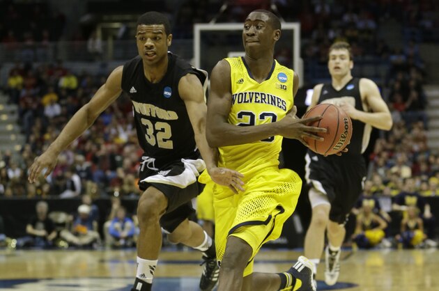 Michigan guard Caris LeVert (23) drives the ball during the first half of a second round NCAA college basketball tournament game against the Wofford Thursday, March 20, 2014, in Milwaukee. (AP Photo/Morry Gash)