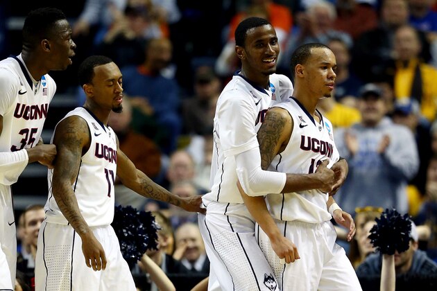 BUFFALO, NY - MARCH 20:  DeAndre Daniels #2 celebrates with Shabazz Napier #13 of the Connecticut Huskies after defeating the Saint Joseph's Hawks 89-81 in the second round of the 2014 NCAA Men's Basketball Tournament at the First Niagara Center on March 20, 2014 in Buffalo, New York.  (Photo by Elsa/Getty Images)