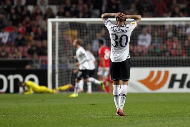 Tottenham's Sandro, foreground, from Brazil, reacts after Benfica's goalkeeper Jan Oblak, background on the pitch, from Slovenia, makes a save during the Europa League, round of 16, second leg soccer match between Benfica and Tottenham at Benfica's Luz stadium, in Lisbon, Thursday, March 20, 2014. Benfica won 5-3 on aggregate and advances to the next round. (AP Photo/Francisco Seco)
