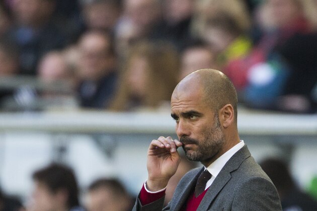 Bayern head coach Pep Guardiola of Spain gestures during the German Bundesliga soccer match between VfL Wolfsburg and Bayern Munich inย Wolfsburg, Germany, Saturday, March 8, 2014. (AP Photo/Gero Breloer)ย Bayern head coach Pep Guardiola of Spain gestures during the German Bundesliga soccer match between VfL Wolfsburg and Bayern Munich inย Wolfsburg, Germany, Saturday, March 8, 2014. (AP Photo/Gero Breloer)ย