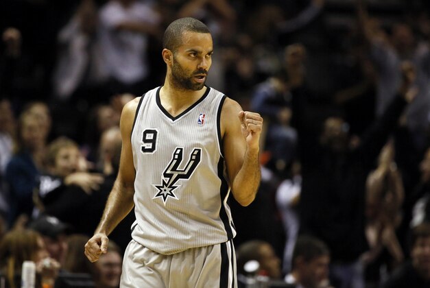 Dec 29, 2013; San Antonio, TX, USA; San Antonio Spurs guard Tony Parker (9) reacts after a shot during the second half against the Sacramento Kings at the AT&T Center. The Spurs won 112-104. Mandatory Credit: Soobum Im-USA TODAY Sports
