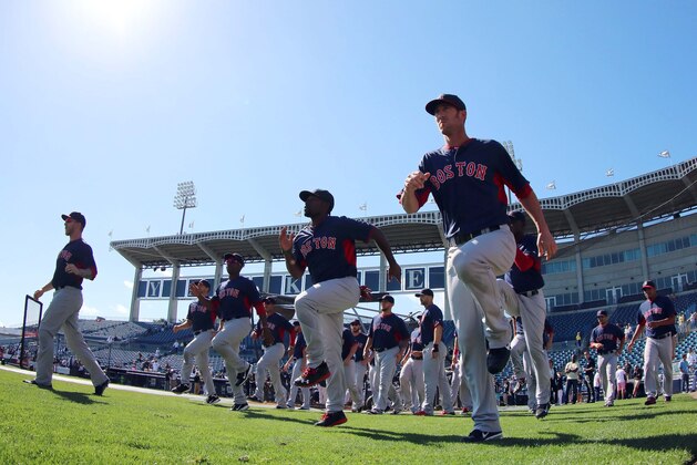 Mar 18, 2014; Tampa, FL, USA; Boston Red Sox relief pitcher Tommy Layne (59), center fielder Jackie Bradley Jr. (25) and teammates work out prior to the game against the New York Yankees at George M. Steinbrenner Field. Mandatory Credit: Kim Klement-USA TODAY Sports