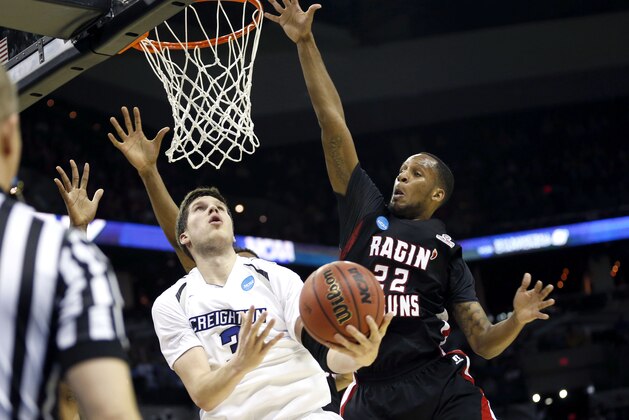 Mar 21, 2014; San Antonio, TX, USA; Louisiana Lafayette Ragin Cajuns forward Elridge Moore (22) defends against Creighton Bluejays forward Doug McDermott (3) in the first half of a men's college basketball game during the second round of the 2014 NCAA Tournament at AT&T Center. Mandatory Credit: Soobum Im-USA TODAY Sports