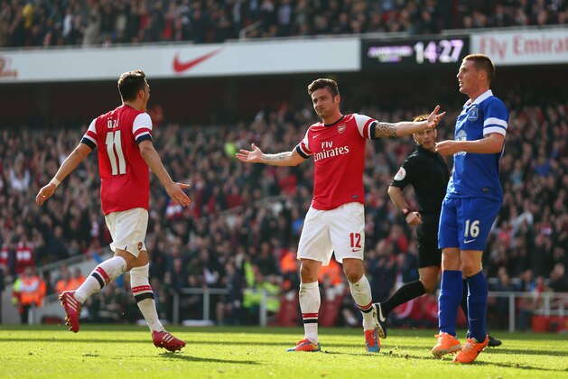 LONDON, ENGLAND - MARCH 08:  Olivier Giroud of Arsenal celebrates with teammate Mesut Oezil after scoring his team's fourth goal during the FA Cup Quarter-Final match between Arsenal and Everton at Emirates Stadium on March 8, 2014 in London, England.  (Photo by Paul Gilham/Getty Images)