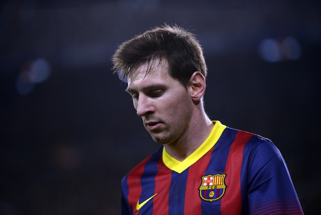 FC Barcelona's Lionel Messi, from Argentina, looks on against Rayo Vallecano during a Spanish La Liga soccer match at the Camp Nou stadium in Barcelona, Spain, Saturday, Feb. 15, 2014. (AP Photo/Manu Fernandez)