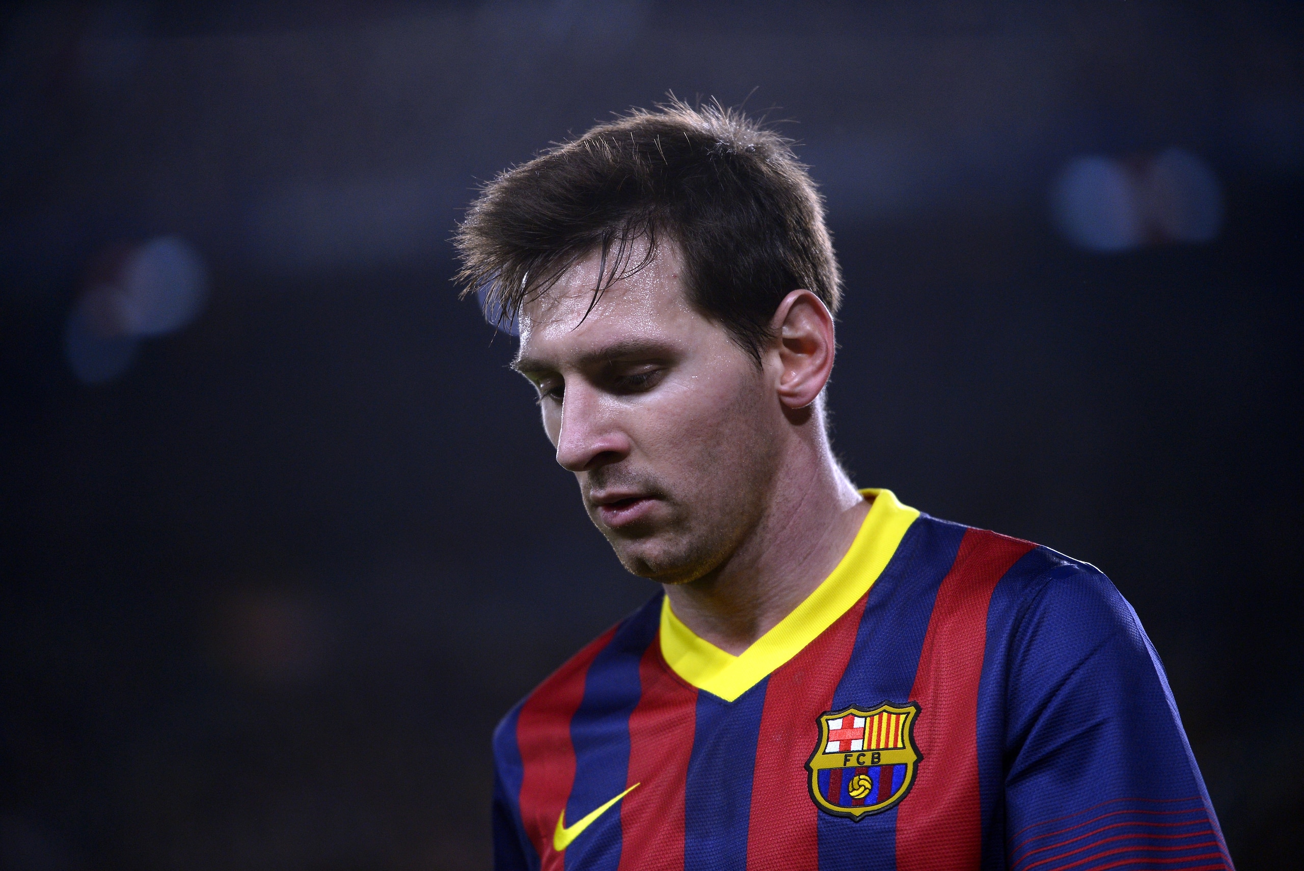 FC Barcelona's Lionel Messi, from Argentina, looks on against Rayo Vallecano during a Spanish La Liga soccer match at the Camp Nou stadium in Barcelona, Spain, Saturday, Feb. 15, 2014. (AP Photo/Manu Fernandez)