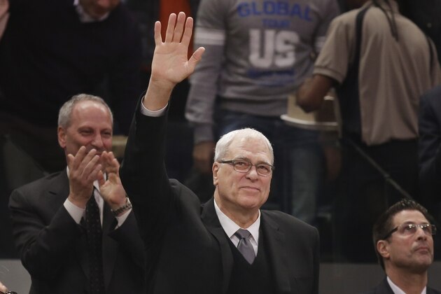 Phil Jackson waves to the crowd as he is introduced during the first half of an NBA basketball game between the New York Knicks and the Indiana Pacers at Madison Square Garden on Wednesday, March 19, 2014, in New York. Jackson was hired as the president of the Knicks this week. (AP Photo/Seth Wenig)