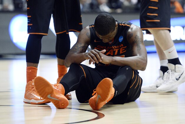 Mar 21, 2014; San Diego, CA, USA; Oklahoma State Cowboys guard Marcus Smart (33) reacts in the first half of a men's college basketball game during the second round of the 2014 NCAA Tournament against the Gonzaga Bulldogs at Viejas Arena. Mandatory Credit: Robert Hanashiro-USA TODAY Sports