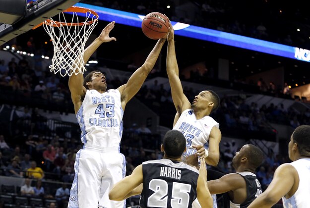 Mar 21, 2014; San Antonio, TX, USA; North Carolina Tar Heels forward James Michael McAdoo (43) pulls down a rebound over Providence Friars forward Tyler Harris (25) in the first half of a men's college basketball game during the second round of the 2014 NCAA Tournament at AT&T Center. Mandatory Credit: Kevin Jairaj-USA TODAY Sports