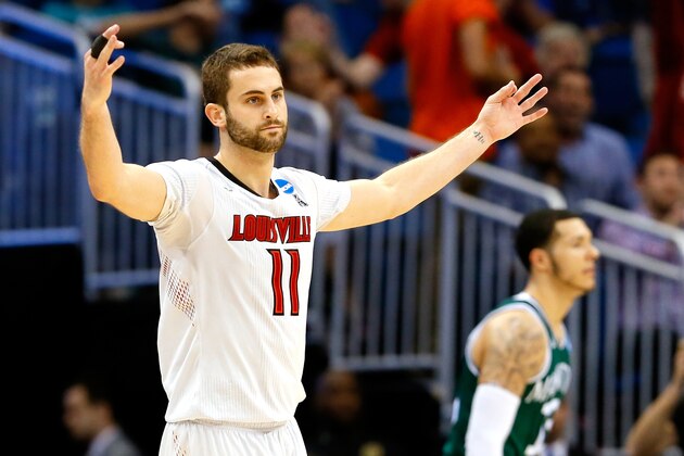 ORLANDO, FL - MARCH 20:  Luke Hancock #11 of the Louisville Cardinals celebrates after his second three point in the second half against the Manhattan Jaspers during the second round of the 2014 NCAA Men's Basketball Tournament at Amway Center on March 20, 2014 in Orlando, Florida.  (Photo by Kevin C. Cox/Getty Images)