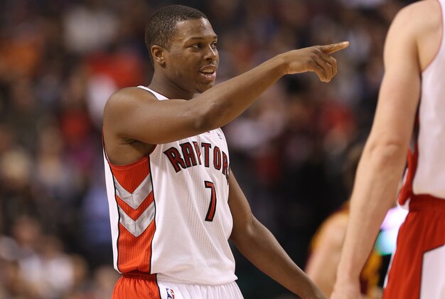 Feb 21, 2014; Toronto, Ontario, CAN; Toronto Raptors point guard Kyle Lowry (7) celebrates after scoring against the Cleveland Cavaliers at Air Canada Centre. The Raptors won 98-91. Mandatory Credit: Tom Szczerbowski-USA TODAY Sports