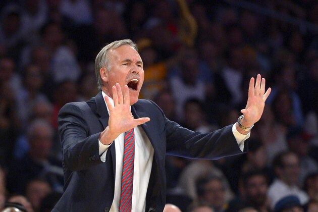 Los Angeles Lakers head coach Mike D'Antoni gestures to his team during the first half of their NBA basketball game against the San Antonio Spurs, Wednesday, March 19, 2014, in Los Angeles. (AP Photo/Mark J. Terrill)