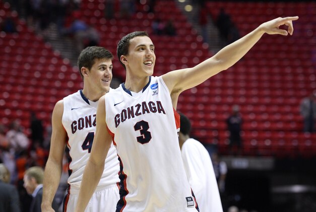Mar 21, 2014; San Diego, CA, USA;  Gonzaga Bulldogs guard Kyle Dranginis (3) and guard/forward Drew Barham (43) leave the court after defeating Oklahoma State Cowboys in a men's college basketball game during the second round of the 2014 NCAA Tournament at Viejas Arena. Mandatory Credit: Christopher Hanewinckel-USA TODAY Sports