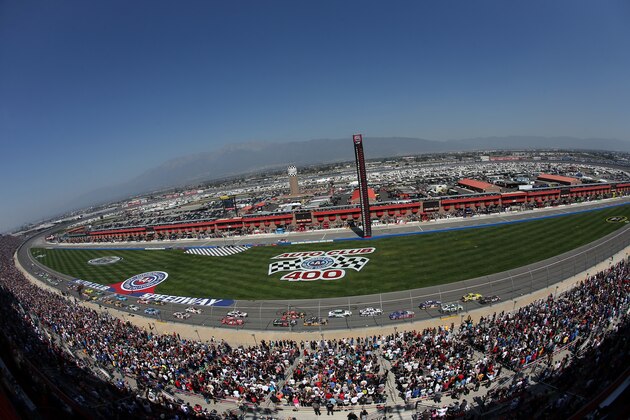 FONTANA, CA - MARCH 24:  Denny Hamlin, driver of the #11 FedEx Express Toyota, and Matt Kenseth, driver of the #20 Dollar General Toyota, lead the field to start of the NASCAR Sprint Cup Series Auto Club 400 at Auto Club Speedway on March 24, 2013 in Fontana, California.  (Photo by Jeff Gross/Getty Images)