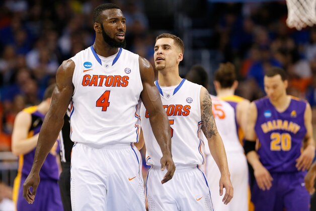 ORLANDO, FL - MARCH 20:  Patric Young #4 reacts with teammate Scottie Wilbekin #5 of the Florida Gators in the second half against the Albany Great Danes during the second round of the 2014 NCAA Men's Basketball Tournament at Amway Center on March 20, 2014 in Orlando, Florida.  (Photo by Kevin C. Cox/Getty Images)