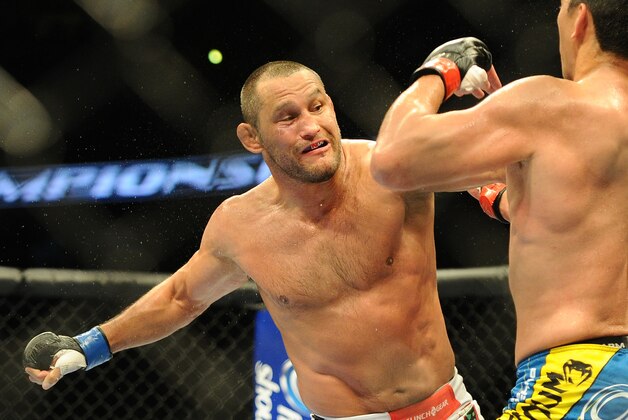 Feb 23, 2013; Anaheim, CA, USA; Lyoto Machida (blue shorts) and Dan Henderson (white shorts) during their UFC heavyweight bout at the Honda Center. Mandatory Credit: Jayne Kamin-Oncea-USA TODAY Sports