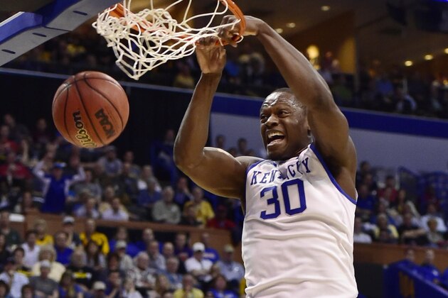 Mar 21, 2014; St. Louis, MO, USA; Kentucky Wildcats forward Julius Randle (30) dunks the ball ahead of Kansas State Wildcats guard Nigel Johnson (23) in the first half during the 2nd round of the 2014 NCAA Men's  Basketball Championship at Scottrade Center. Mandatory Credit: Scott Rovak-USA TODAY Sports