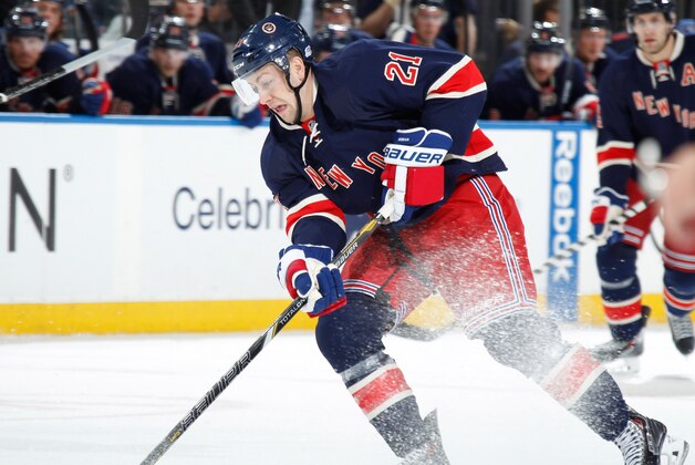 NEW YORK, NY - MARCH 05:  Derek Stepan #21 of the New York Rangers skates with the puck against the Toronto Maple Leafs at Madison Square Garden on March 5, 2014 in New York City. The Toronto Maple Leafs won 3-2. (Photo by Scott Levy/NHLI via Getty Images)