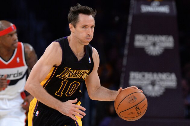 Mar 21, 2014; Los Angeles, CA, USA;    Los Angeles Lakers guard Steve Nash (10) takes the ball down court during the second half of the game against the Washington Wizards at Staples Center. Wizards won 117-107. Mandatory Credit: Jayne Kamin-Oncea-USA TODAY Sports