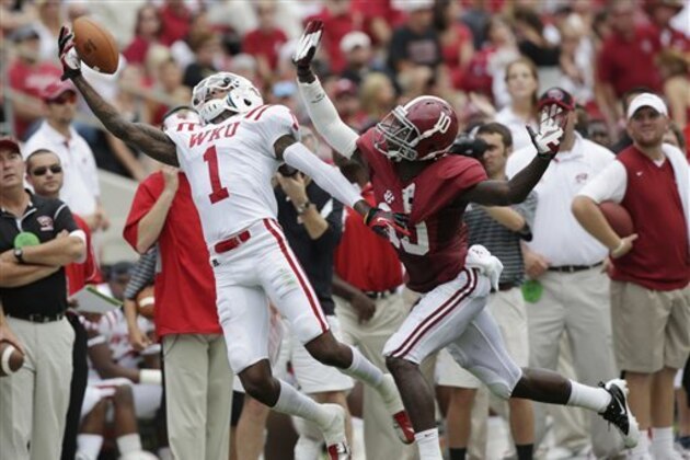 Western Kentucky defensive back Jonathan Dowling (1) can't haul in a first quarter pass as Alabama defensive back John Fulton (10) defends in an NCAA college football game at Bryant Denny Stadium in Tuscaloosa, Ala., Saturday, Sept. 8, 2012. (AP Photo/Dave Martin)