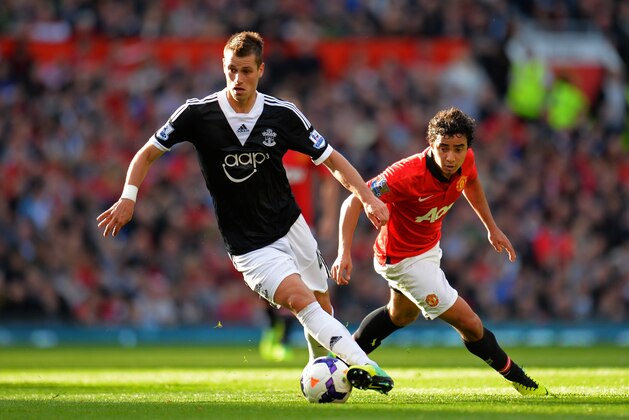 MANCHESTER, ENGLAND - OCTOBER 19:  Morgan Schneiderlin of Southampton is pursed by Rafael of Manchester United during the Barclays Premier League match between Manchester United and Southampton at Old Trafford on October 19, 2013 in Manchester, England.  (Photo by Shaun Botterill/Getty Images)